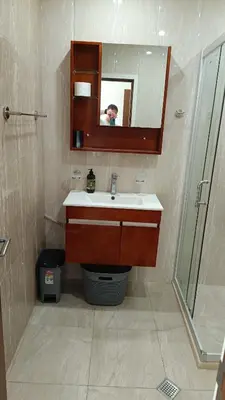 a bathroom with a sink and a mirror and a shower at One Bedroom Apartment 4 - Restaurant Stadium Plovdiv in Plovdiv