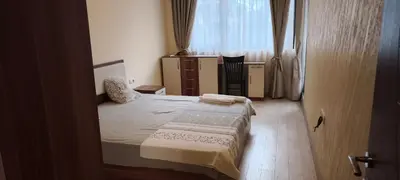 a small bedroom with a bed and a window at One Bedroom Apartment 2 - Restaurant Stadium Plovdiv in Plovdiv