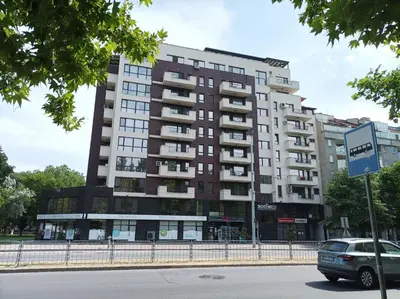 a tall apartment building on a city street at One Bedroom Apartment 2 - Restaurant Stadium Plovdiv in Plovdiv