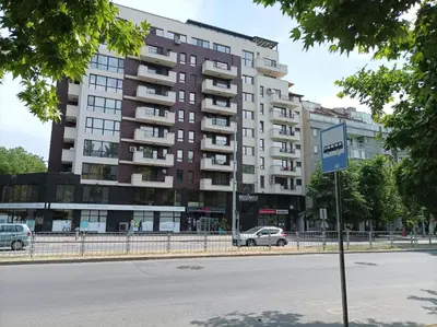 a large apartment building on the side of a street at One Bedroom Apartment 2 - Restaurant Stadium Plovdiv in Plovdiv