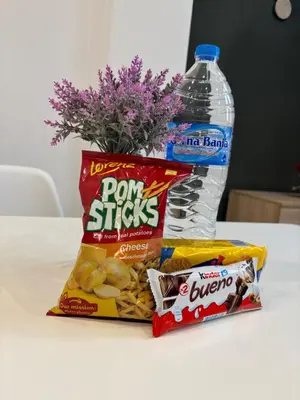 a bag of potato chips and a bottle of water at Luxury & Comfort near the University in Blagoevgrad