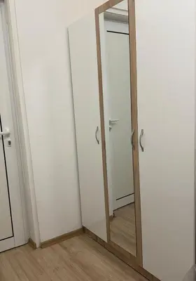 a mirror in the corner of a room at Center Chill ARTpartment in Sofia