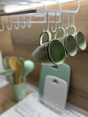 a group of measuring utensils hanging from a rack at Center Chill ARTpartment in Sofia