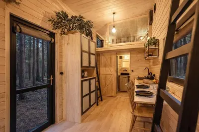 a kitchen and dining room in a tiny house at Малка Къщичка Бяла Черква