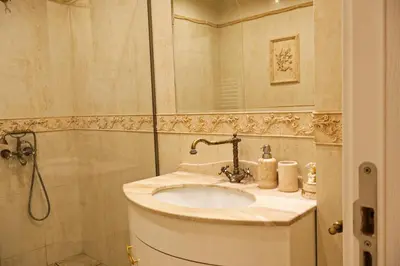 a bathroom with a sink and a shower at Апартамент за гости Марица in Asenovgrad