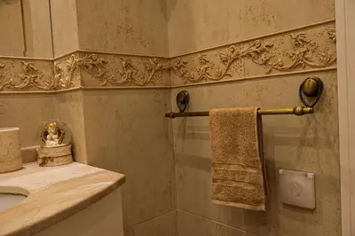 a bathroom with a sink and a towel at Апартамент за гости Марица in Asenovgrad