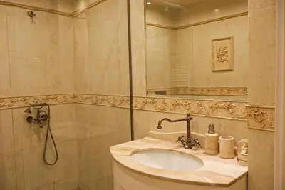 a bathroom with a sink and a shower at Апартамент за гости Марица in Asenovgrad