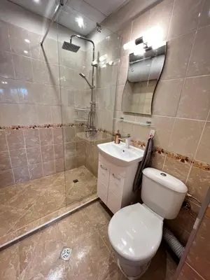 a bathroom with a toilet and a shower and a sink at Warsaw Cozy Studio near UNSS and NSA with Balcony in Sofia