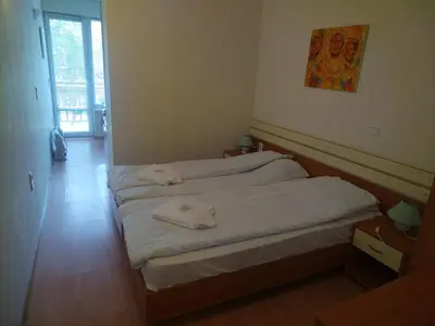 a bedroom with two beds with white sheets at Sunny Studio Eagle Rock in Beli Iskar