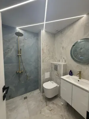 a bathroom with a shower and a toilet and a sink at River side apartment in Sandanski