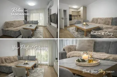 a living room with a couch and a table at River side apartment in Sandanski