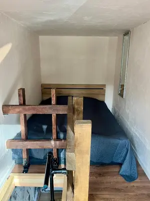 a bedroom with a bunk bed in a small room at The Cube in Samokov