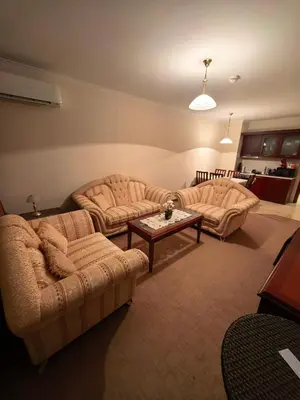 a living room with two couches and a coffee table at Mountain Heaven Downtown in Bansko