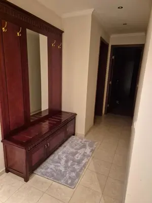 a bathroom with a wooden dresser and a mirror at Mountain Heaven Downtown in Bansko