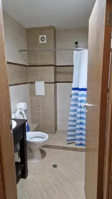a bathroom with a toilet and a shower at Studio Kalina Green Life in Pamporovo