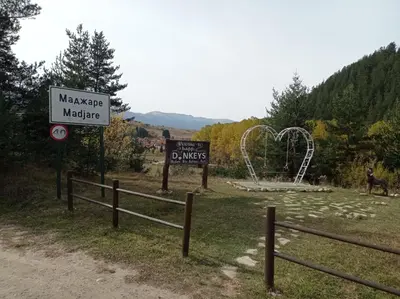a sign for a park with a roller coaster at Марковата Къща in Madzhare