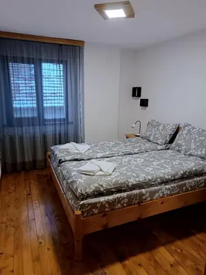 a bedroom with a bed and a window at Марковата Къща in Madzhare