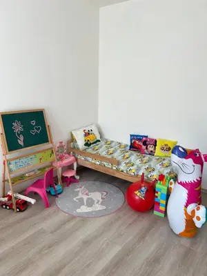 a childs bedroom with a bed and a chalkboard at Cozy apartment kids friendly in Sofia