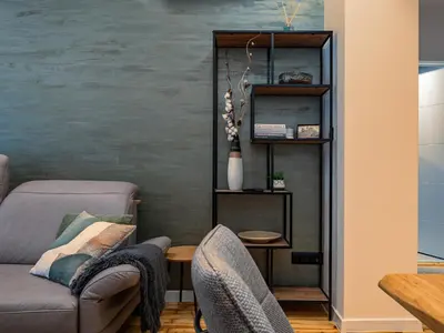 a living room with a couch and a table at Stylish New High-End 3BR Apt on Vitoshka Blvd in Sofia
