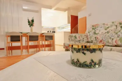 a table with a bowl on top of a table at GOLF Queen MARIA Apartment Home2Host in Razlog