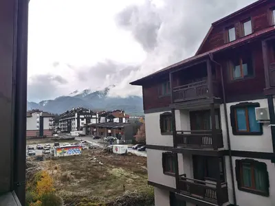 a view from a window of a building with a parking lot at Bansko Peak Apartments 304 in Bansko