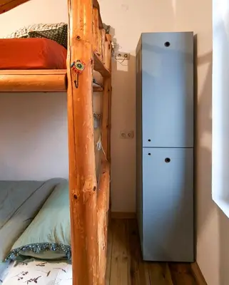 a room with two bunk beds and a locker at PORTALA Urban Lodge in Rila