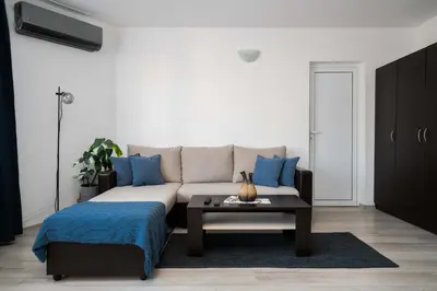a living room with a couch and a coffee table at Sunny & Modern 1BR Apartment in Sofia