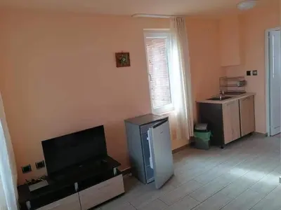 a living room with a flat screen tv and a flat screen tv at Свети Георги in Tsigov Chark