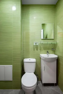 a bathroom with a white toilet and a sink at Life in Colours - Artistic 1BD Apartment in Sofia
