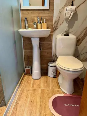 a bathroom with a sink and a toilet at Yeti Complex in Bansko