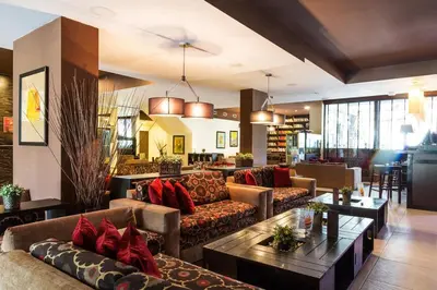 a living room with couches and a table at Private Ap in Perun Lodge Ski Escape & Spa in Bansko