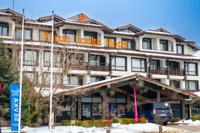a building with a sign that reads main lodge hotel at Private Ap in Perun Lodge Ski Escape & Spa in Bansko