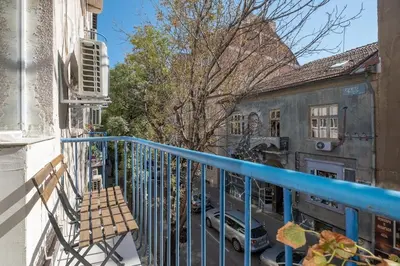 a balcony with a view of a parking lot at Beautiful Bright and Spacious Central Apt in Sofia