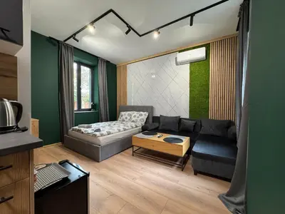 a living room with a couch and a table at Plovdiv City Apartments in Plovdiv