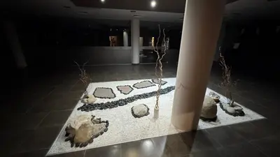 a room with a display of rocks on a floor at Aspen Golf Resort Studio E206 in Bansko