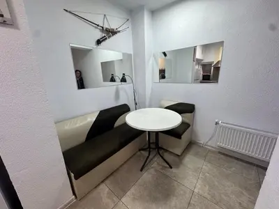 a small room with a table and a couch at Berta Gardens 2 in Sandanski