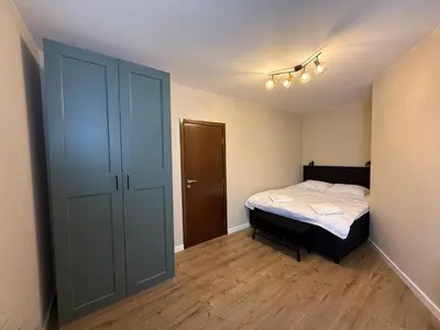 a small bedroom with a bed and a closet at Pamporovo Living Cozy Mountain Home in Chepelare