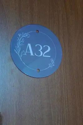 a blue plate with the numbers on it at Cozy Stylish 2-bedroom apt near ski road, 5min to Gondola & bars in Bansko