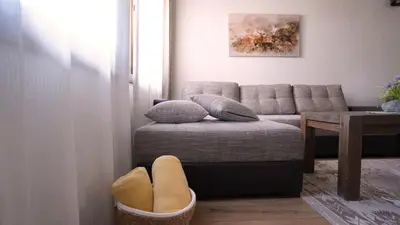 a living room with a couch and a table at Комплекс Белите скали in Gaytaninovo