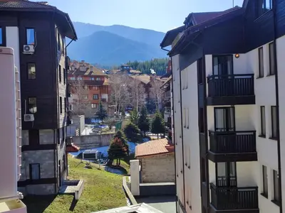 a view of a city from between two buildings at Private Studio in Royal Park in Bansko
