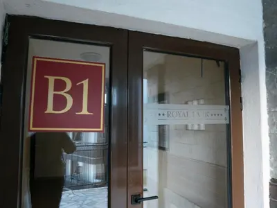 a sign on the door at Private Studio in Royal Park in Bansko