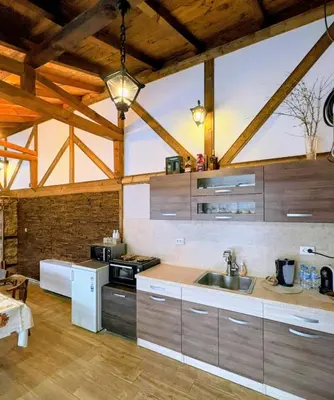 a kitchen with a sink and a counter top at Стаи за гости Царвулджиеви in Koprivshtitsa