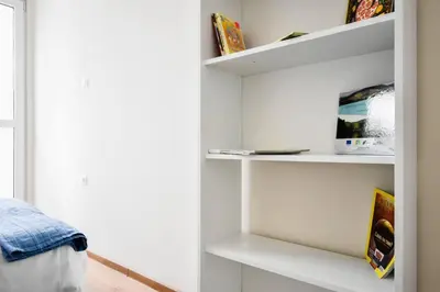 a room with white shelves and a window at 2BR Apt - Parking - Central - 1st floor - ACs in Sofia