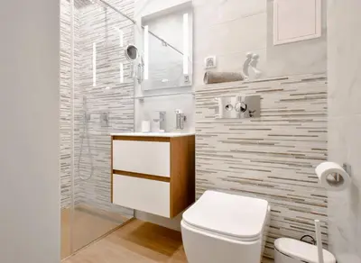 a bathroom with a white toilet and a sink at 2BR Apt - Parking - Central - 1st floor - ACs in Sofia