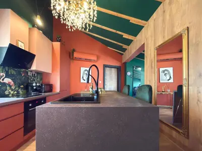 a kitchen with a sink and orange walls at Central 2BR with Designer Interior and Work Desk in Sofia