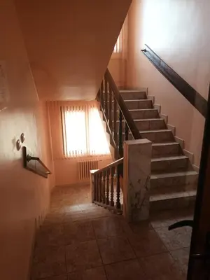 a staircase in a house with a window at Green Hotel Fortuna in Sapareva Banya