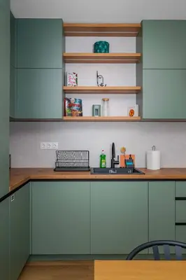 a kitchen with green cabinets and a sink at Spacious 2BR Apartment - Modern Design in Sofia