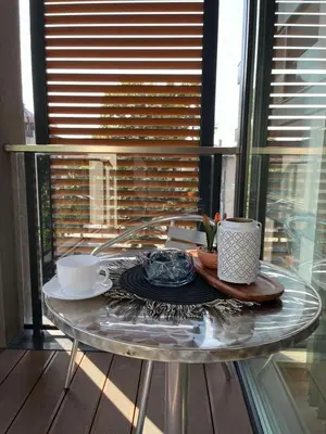 a glass table with two cups and a plate on it at 5 minutes sity center plus parking in Plovdiv