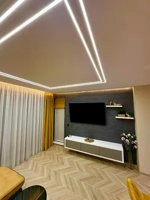 a living room with a flat screen tv on the ceiling at Regatta Park 1BR Exclusive Suite Parking Included in Plovdiv