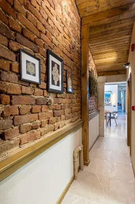 a brick wall in the hallway of a house at Luxurious, modern house in the nature in Belchin in Belchin